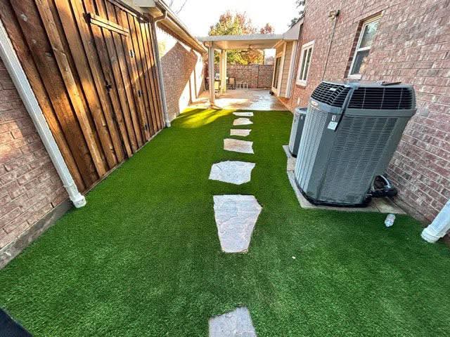 Artificial turf with a flagstone path